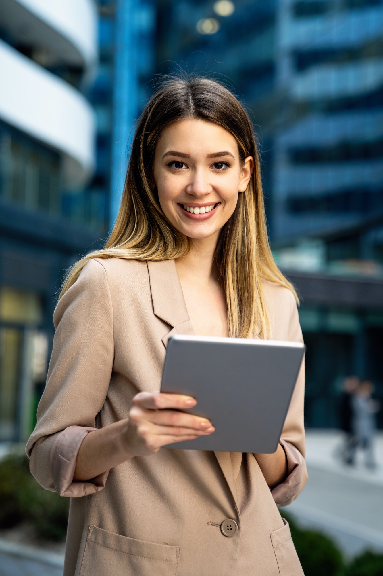 successful-businesswoman-using-a-digital-tablet-while-standing-in-front-of-business-building.jpg successful-businesswoman-using-a-digital-tablet-while-standing-in-front-of-business-building.jpg
